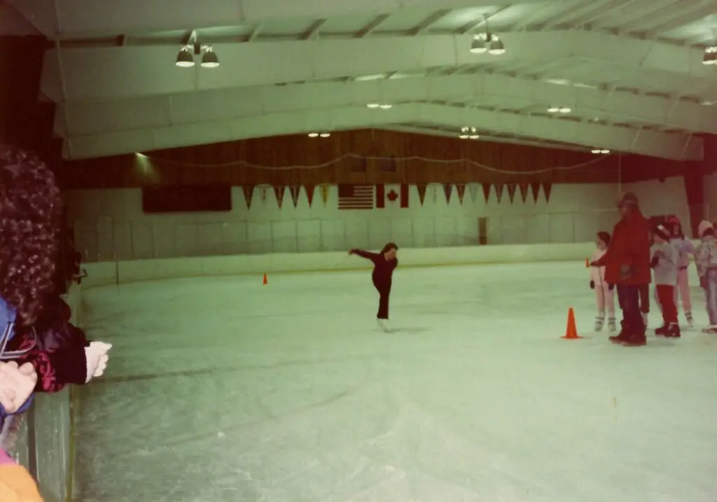 Trina ice skating at a class