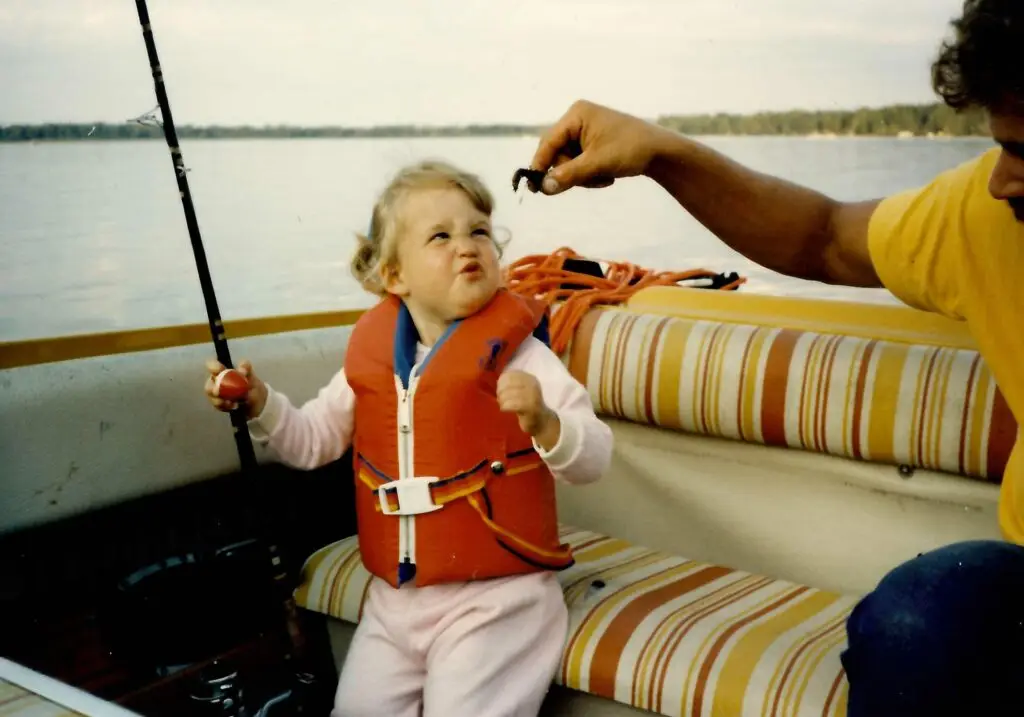 Trina fishing with her father as child