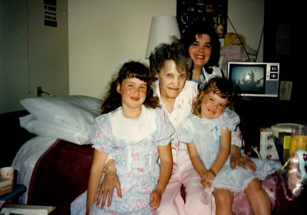 Trina with her grandmother and family