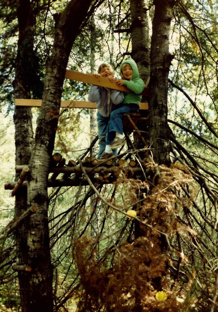 Trina in a treehouse with friends.