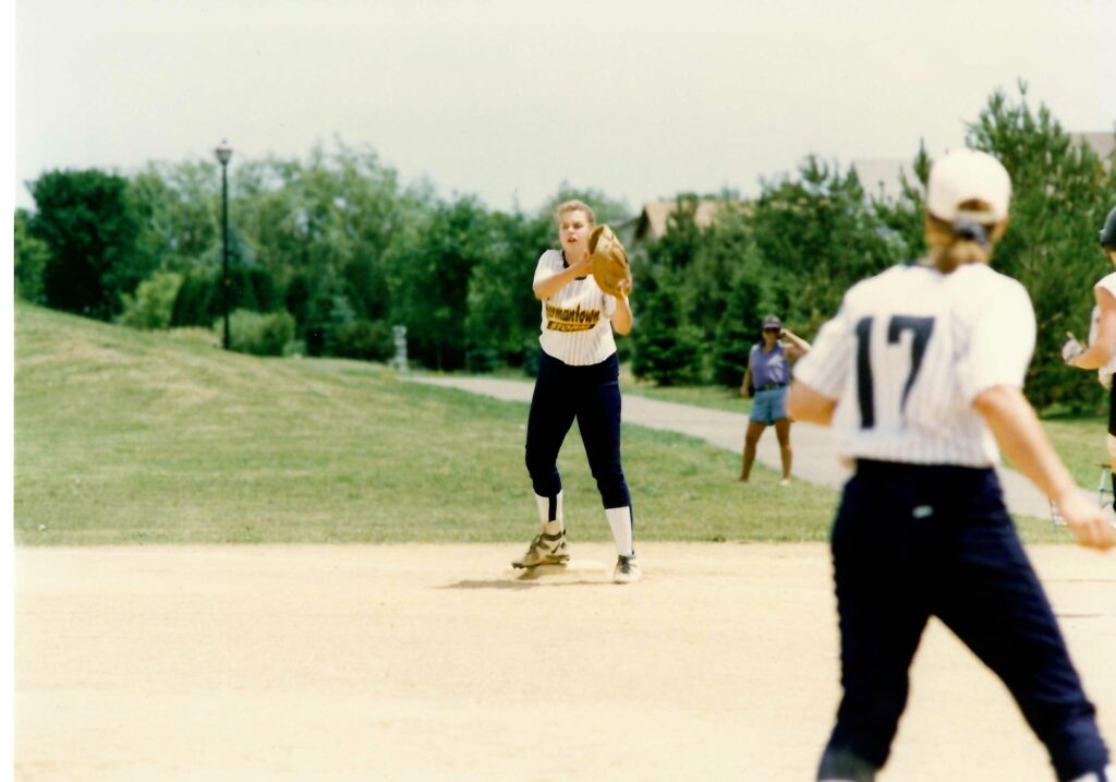 Trina playing softball.