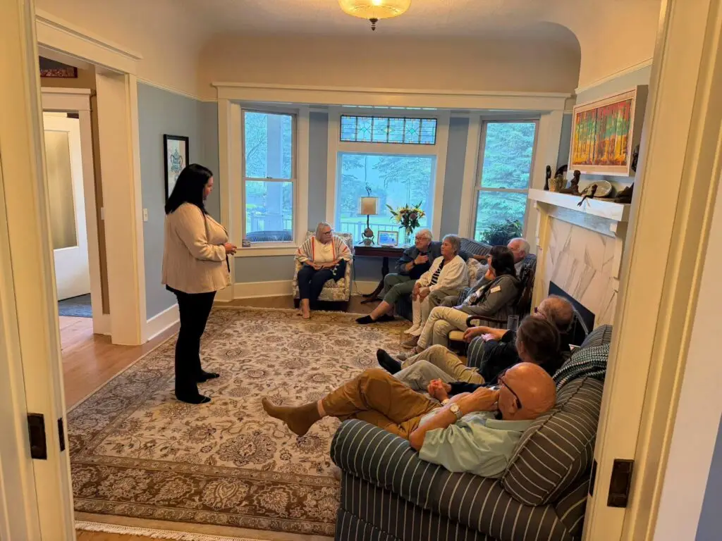 Trina speaking with seniors at a care home.